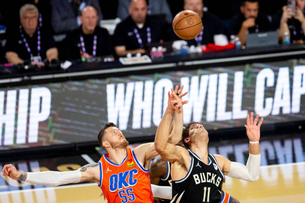 Oklahoma City Thunder center Isaiah Hartenstein (55) and Milwaukee Bucks center Brook Lopez (11 ...