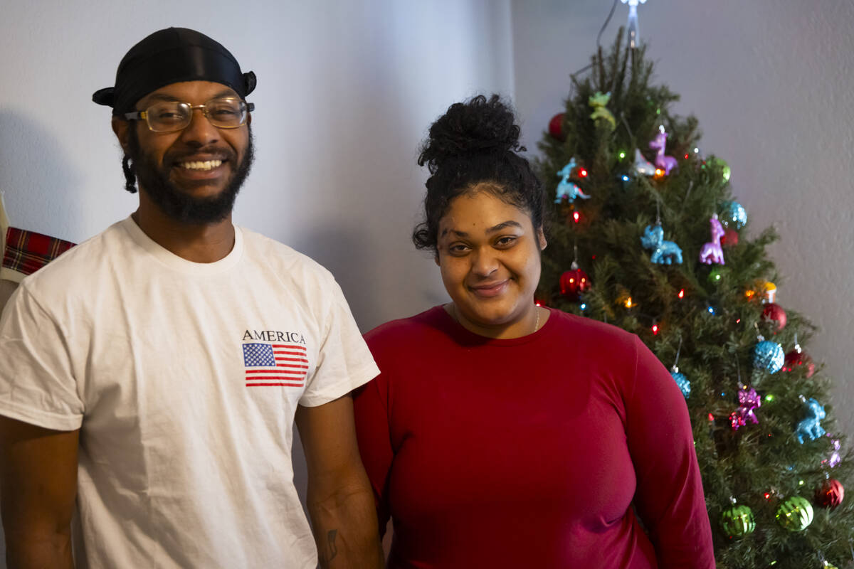 Angelo Crews, left, and Jewel Rodriguez pose for a portrait in their apartment on Sunday, Dec. ...