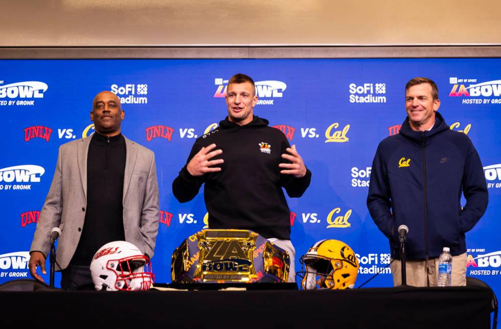 Four-time Super Bowl champion and host of the LA Bowl Rob Gronkowski, center, speaks alongside ...