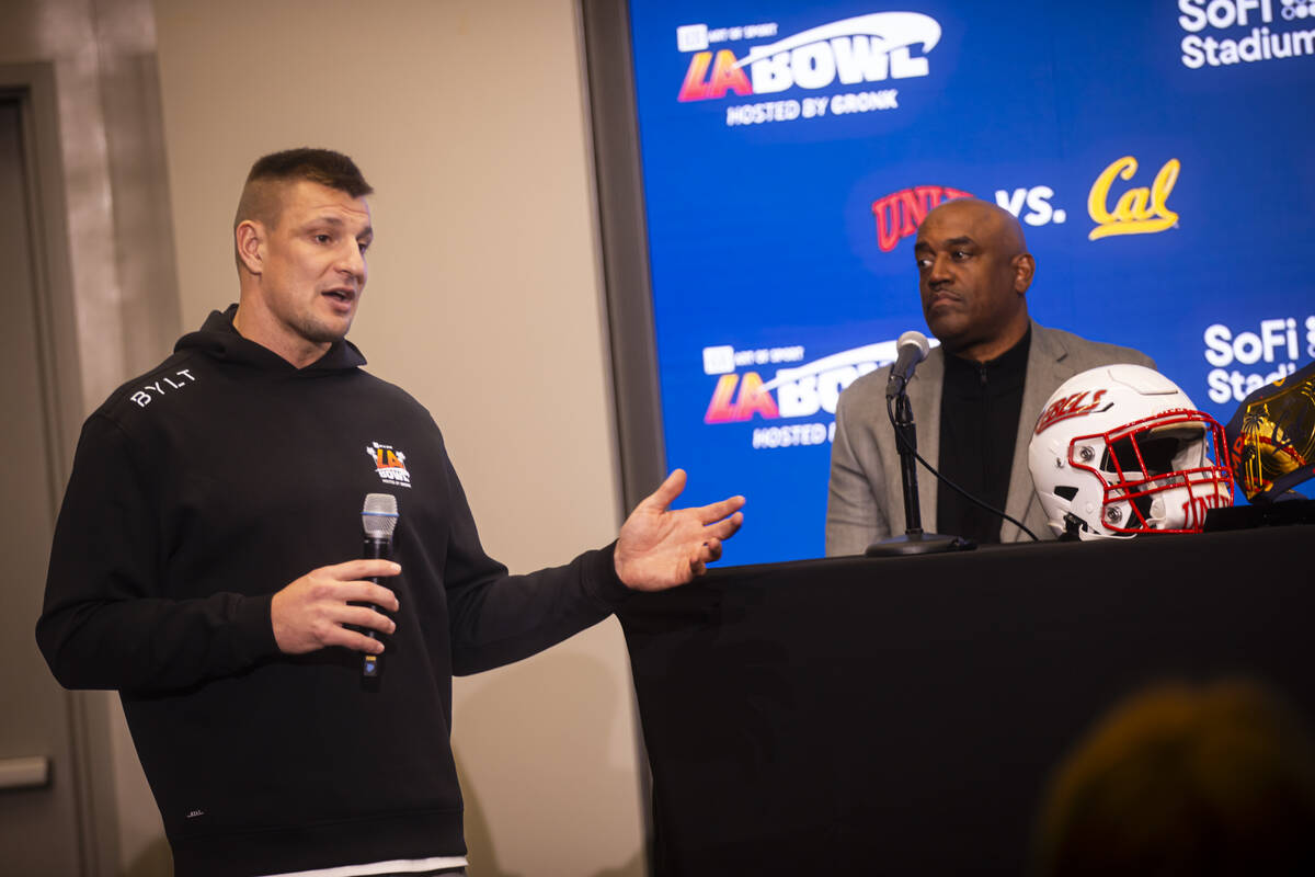 Four-time Super Bowl champion and host of the LA Bowl Rob Gronkowski, left, speaks alongside UN ...