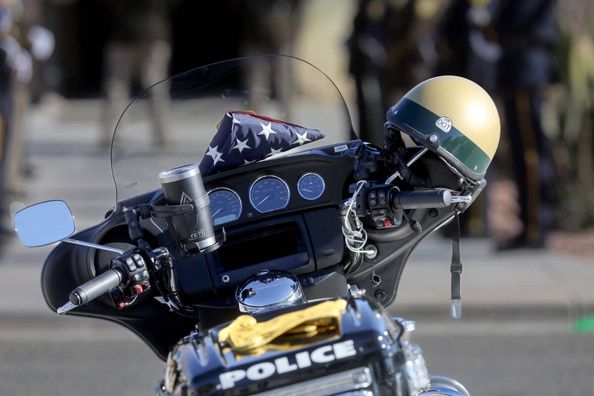 The motorcycle of Las Vegas police officer Colton Pulsipher is shown with an American flag duri ...