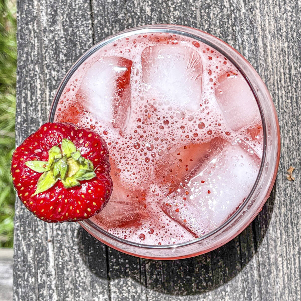 This 2021 image shows a strawberry-basil tonic mocktail. (Suzanne Podhaizer via AP)