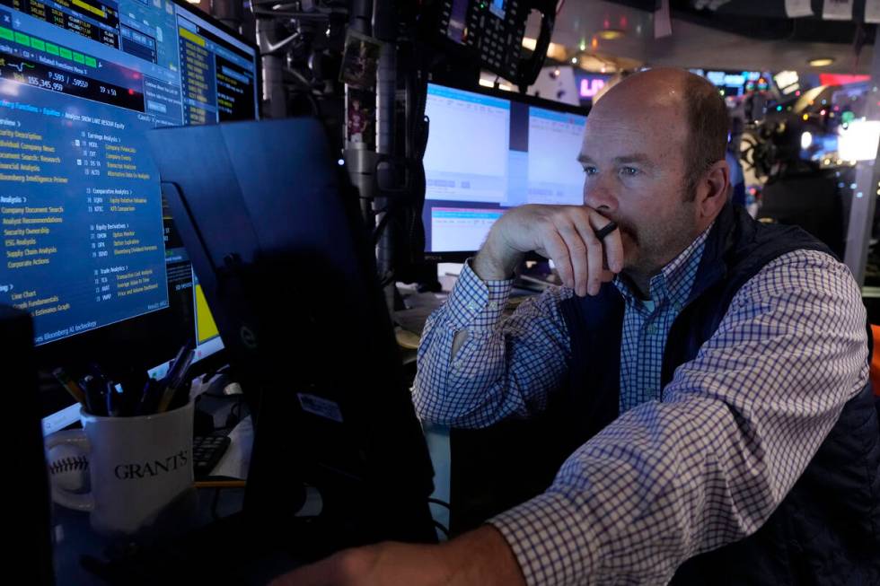 Trader Peter Mancuso works on the floor of the New York Stock Exchange, Wednesday, Dec. 18, 202 ...