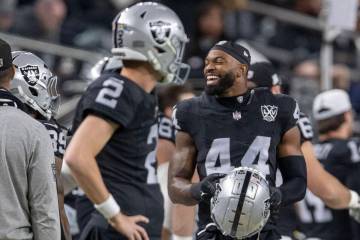 Raiders defensive end K'Lavon Chaisson (44) smiles on the sideline after a sack of Atlanta Falc ...