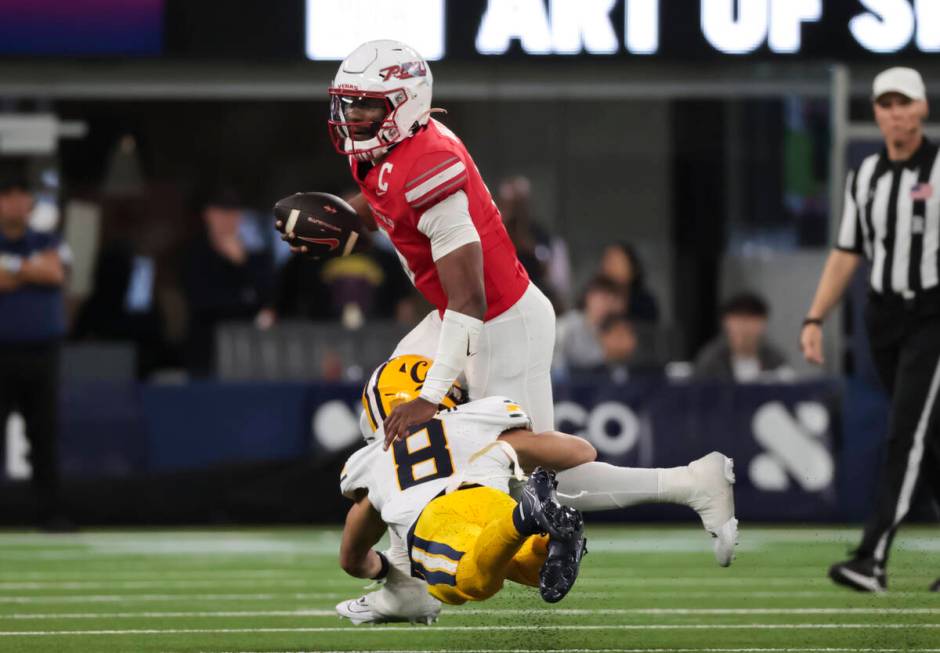 UNLV quarterback Hajj-Malik Williams (6) gets tackled by Cal defensive back Jasiah Wagoner (8) ...