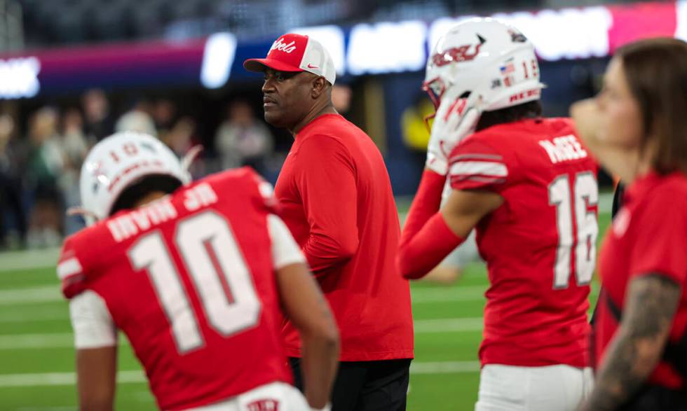 UNLV interim head coach Del Alexander looks on as players warm up before the LA Bowl NCAA colle ...