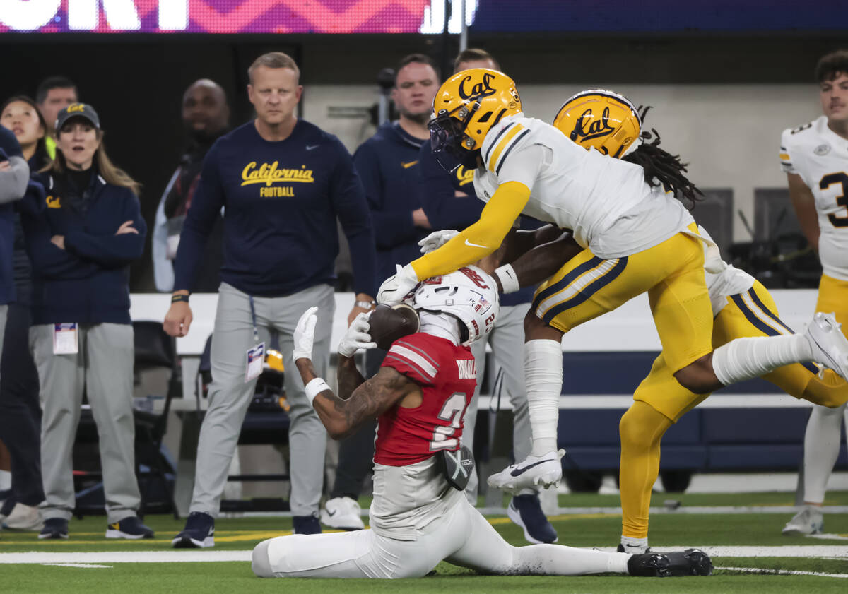 Cal defensive back Miles Williams (4) breaks up a pass intended for UNLV defensive back Saadite ...