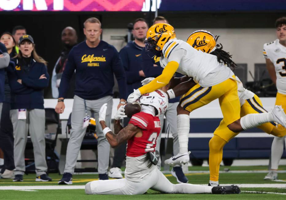 Cal defensive back Miles Williams (4) breaks up a pass intended for UNLV defensive back Saadite ...