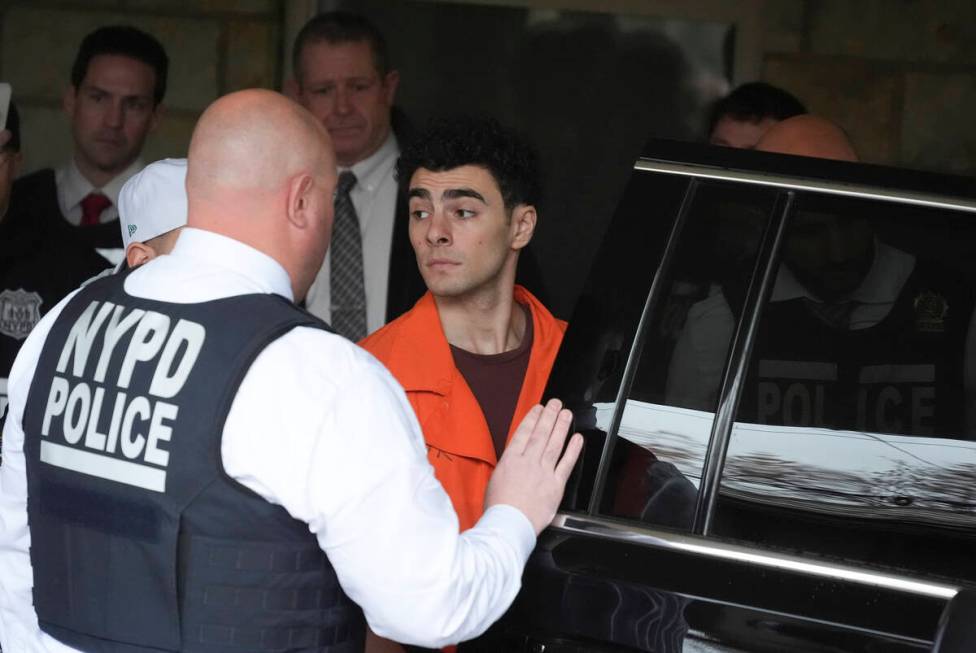 Luigi Nicholas Mangione leaves at Blair County Courthouse in Hollidaysburg, Pa., Thursday, Dec. ...