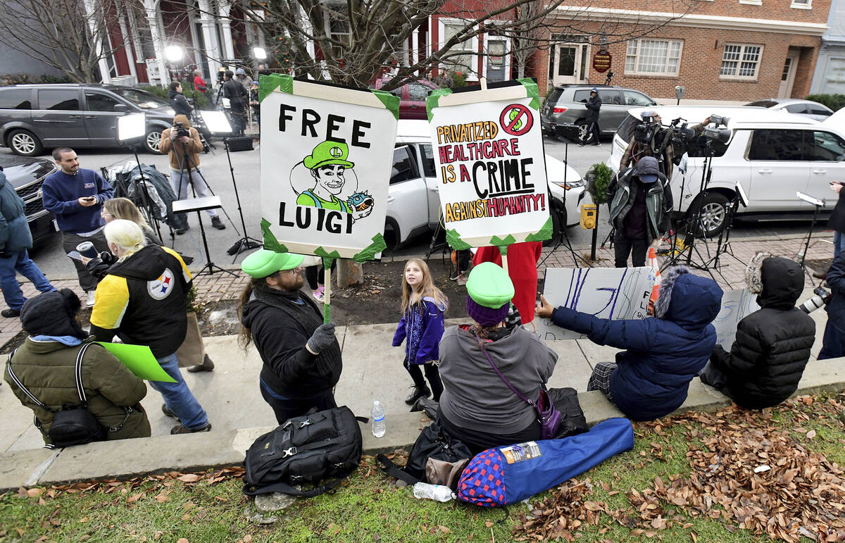 Supporters of Luigi Nicholas Mangione, who is being charged with the murder of UnitedHealthcare ...