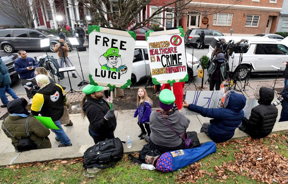 Supporters of Luigi Nicholas Mangione, who is being charged with the murder of UnitedHealthcare ...