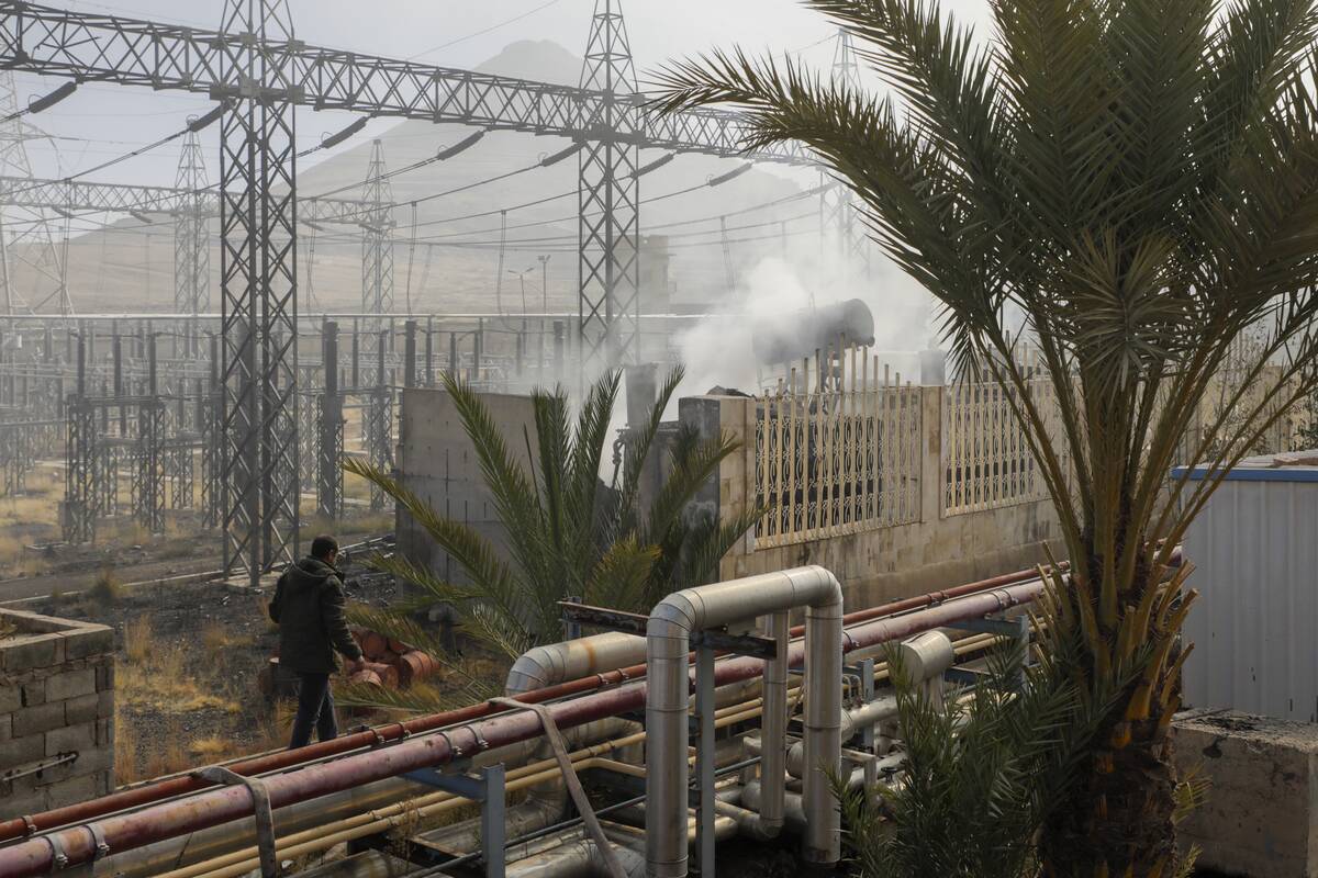 Smoke rises from the scene of an Israeli airstrike on the Haziz power station in southern Sanaa ...