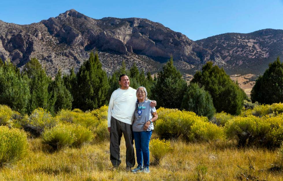 Delaine and Rick Spilsbury stand among Bahsahwahbee, a grove of Rocky Mountain juniper trees lo ...