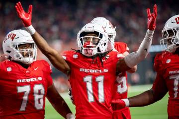 UNLV wide receiver Ricky White III (11) celebrates after scoring a touchdown during the college ...