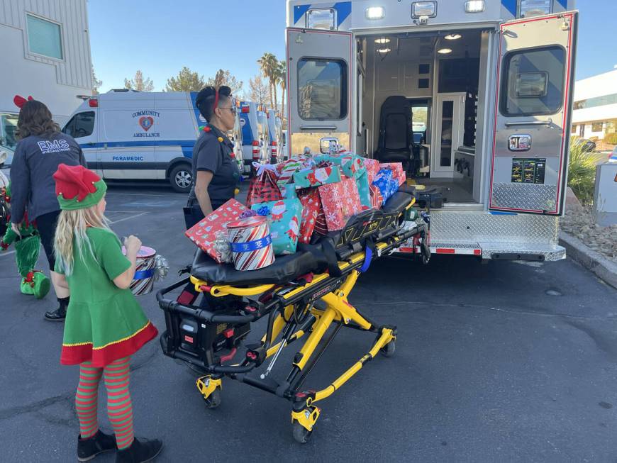 Community Ambulance delivers Christmas gifts to the Hansen Family, including Sarah Hansen and h ...