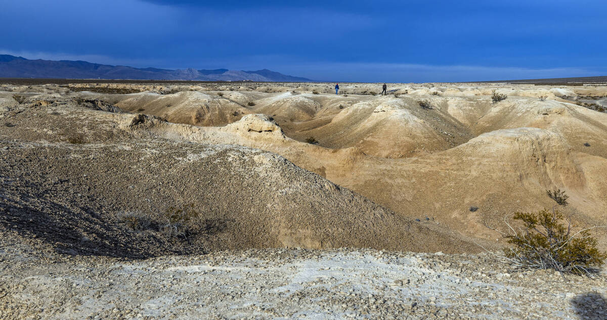 A couple walk about the Tule Springs Fossil Beds National Monument which is one of the location ...