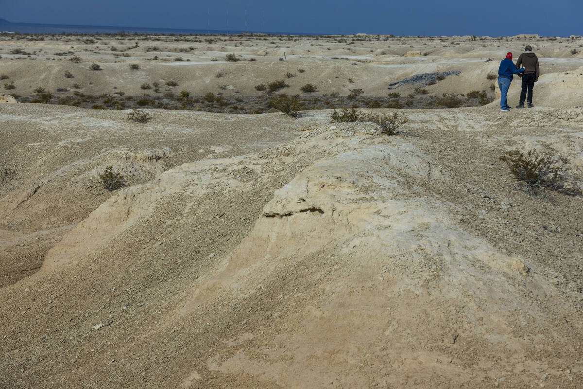 A couple walk about the Tule Springs Fossil Beds National Monument which is one of the location ...