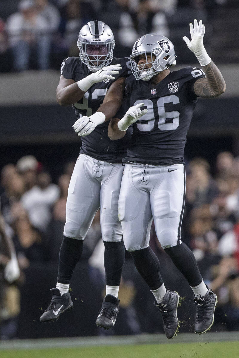 Raiders defensive tackle Jonah Laulu (96) celebrates his sack of Atlanta Falcons quarterback Ki ...