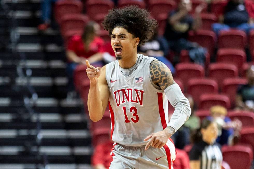 UNLV guard Brooklyn Hicks (13) cheers and points toward his team bench during the second half o ...