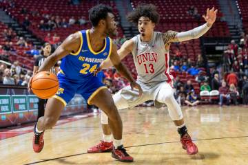 UNLV guard Brooklyn Hicks (13) pressures UC Riverside Highlanders guard Barrington Hargress (24 ...