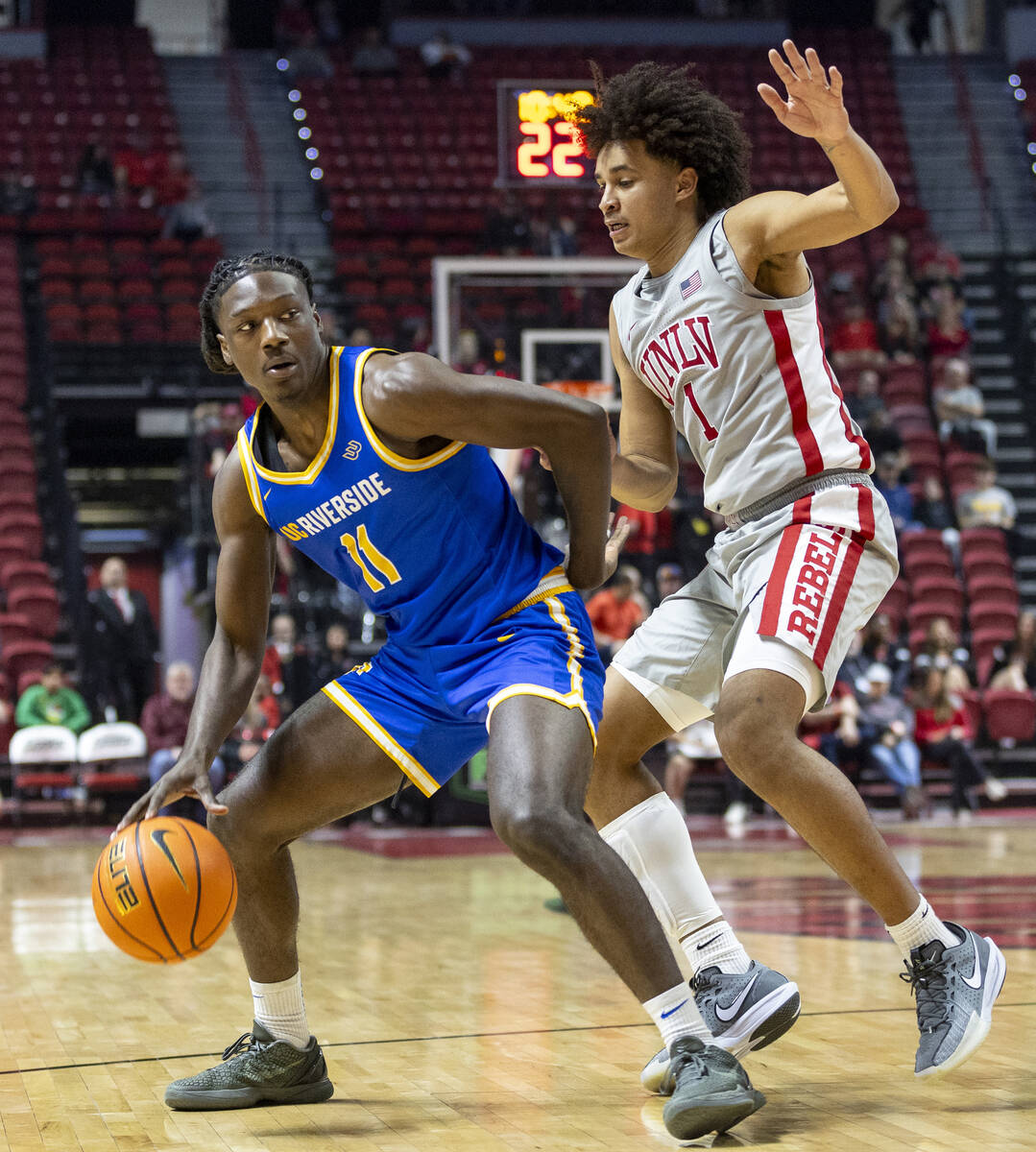 UNLV forward Jalen Hill (1) guards UC Riverside Highlanders guard Nate Pickens (11) during the ...