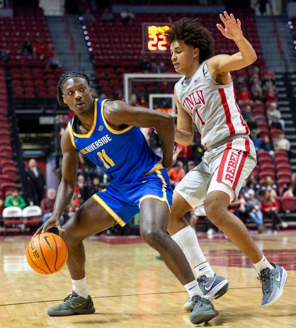 UNLV forward Jalen Hill (1) guards UC Riverside Highlanders guard Nate Pickens (11) during the ...