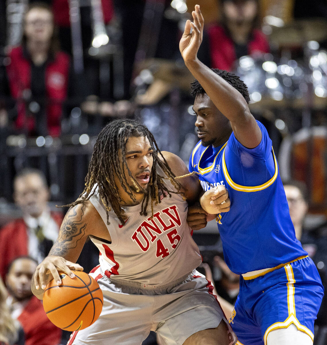 UNLV forward Jeremiah Cherry (45) looks to pass UC Riverside Highlanders center Joel Armotradin ...