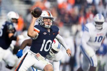 Virginia quarterback Anthony Colandrea (10) looks to make a pass against SMU during the second ...