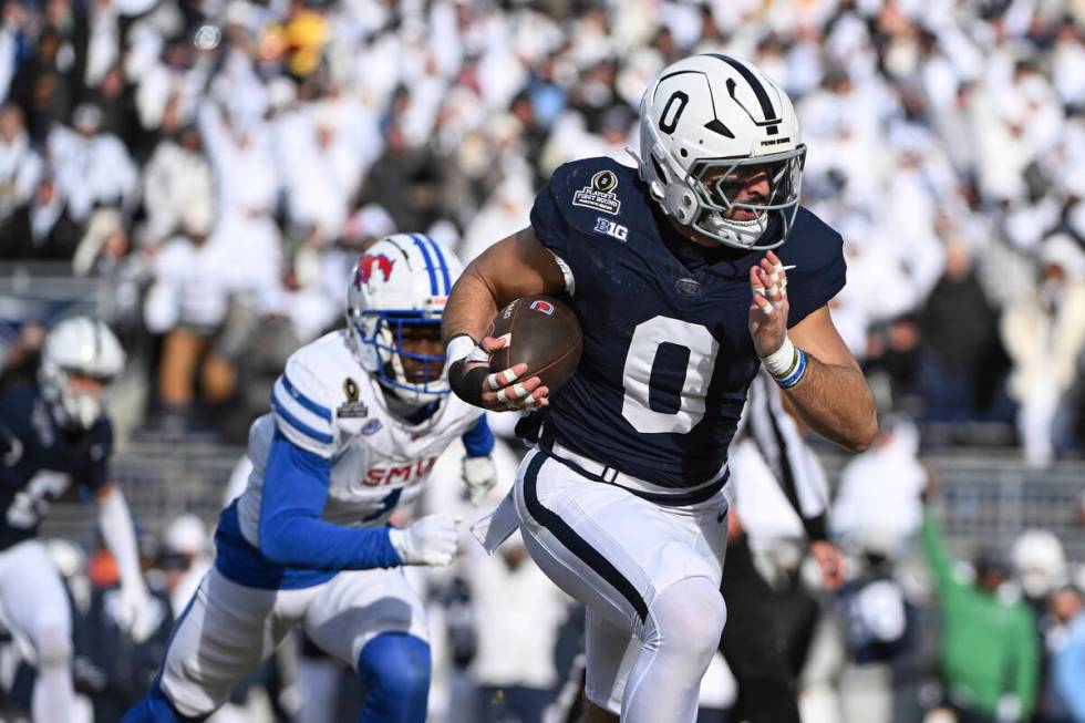 Penn State linebacker Dominic DeLuca returns an interception for a touchdown while being chased ...