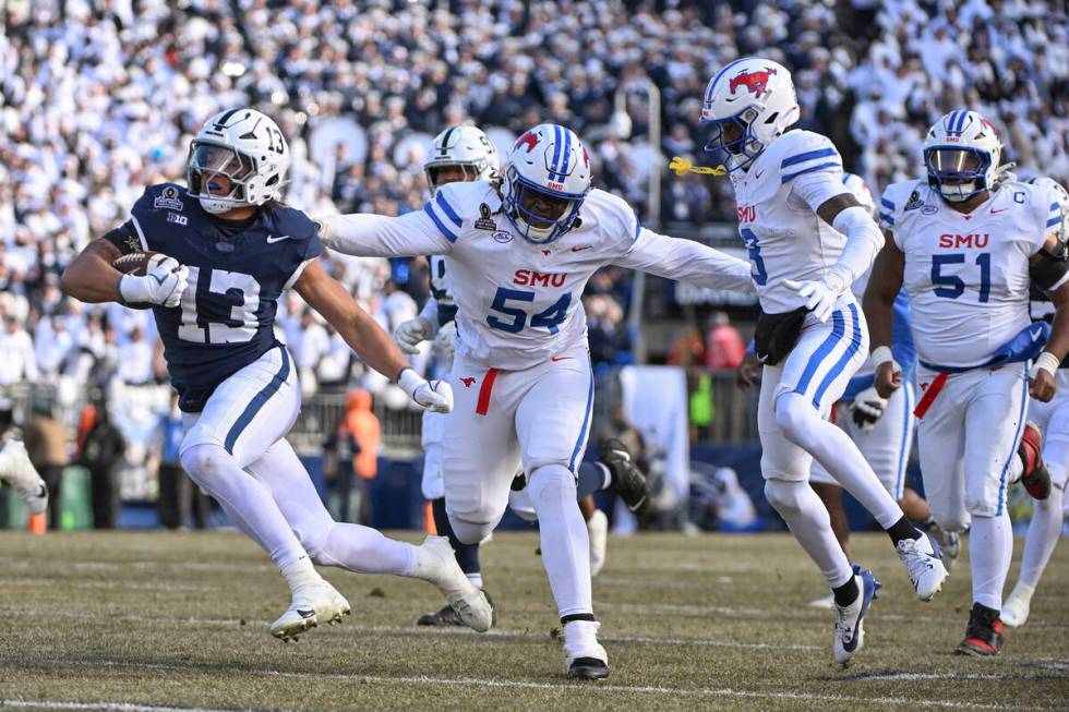 Penn State linebacker Tony Rojas returns an interception for a touchdown while being chased by ...