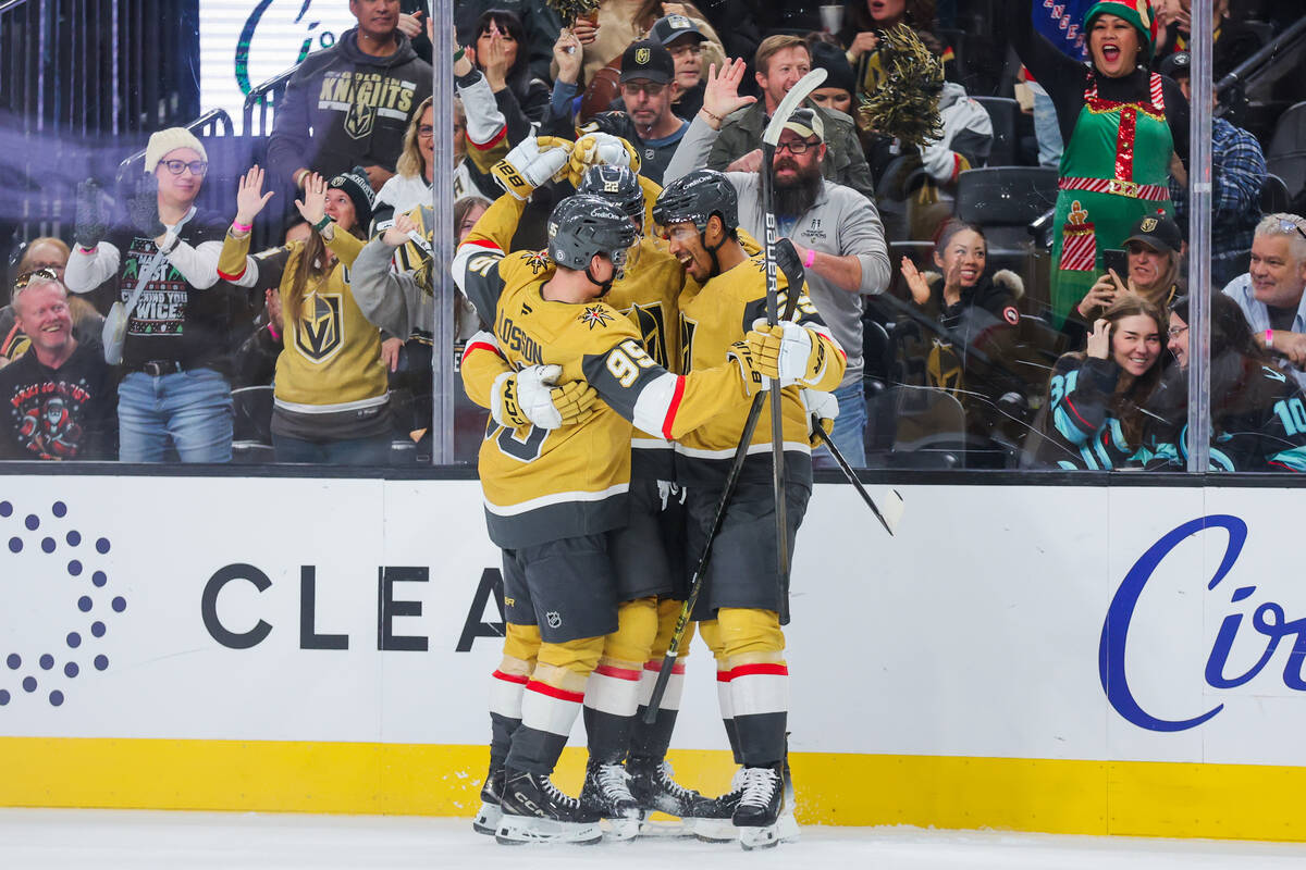 Golden Knights teammates celebrate a goal during an NHL hockey game between the Golden Knights ...