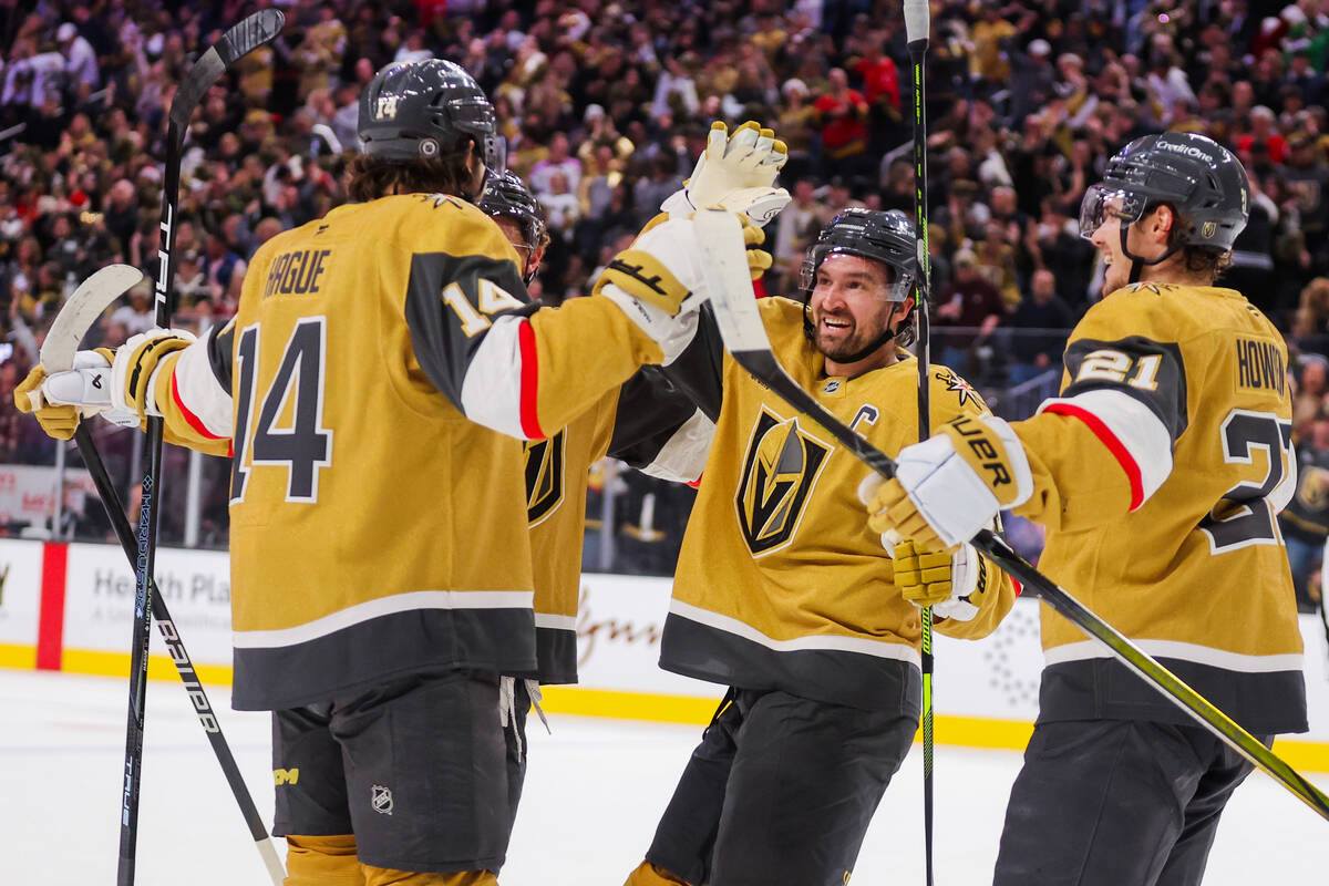 Golden Knights teammates celebrate a goal during an NHL hockey game between the Golden Knights ...