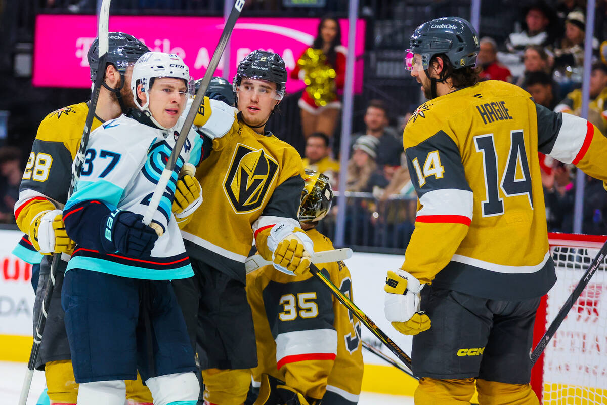 Golden Knights defenseman Zach Whitecloud (2) reacts to Seattle Kraken center Yanni Gourde (37) ...