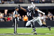 Raiders defensive end K'Lavon Chaisson (44) and Raiders defensive end Charles Snowden (49) cele ...