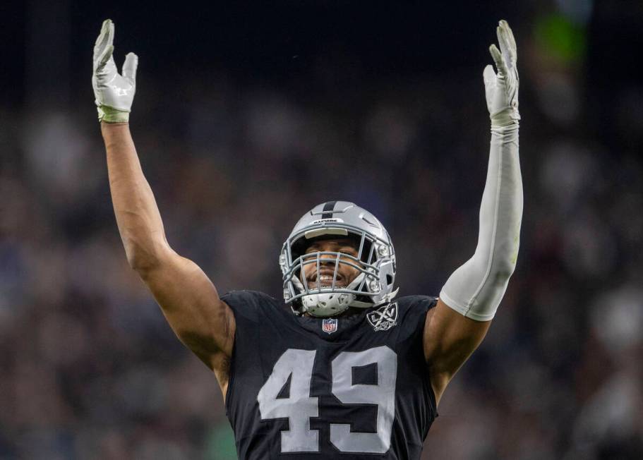 Raiders defensive end Charles Snowden (49) tries to amp up the fans during the second half of a ...