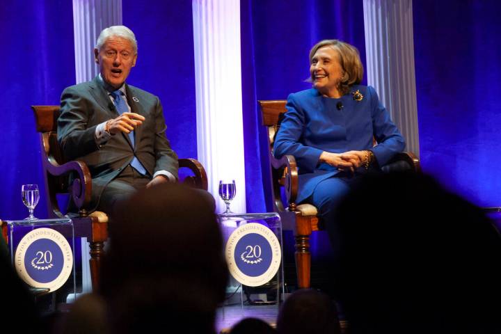 Former President Bill Clinton and former Secretary of State Hillary Rodham Clinton respond to a ...