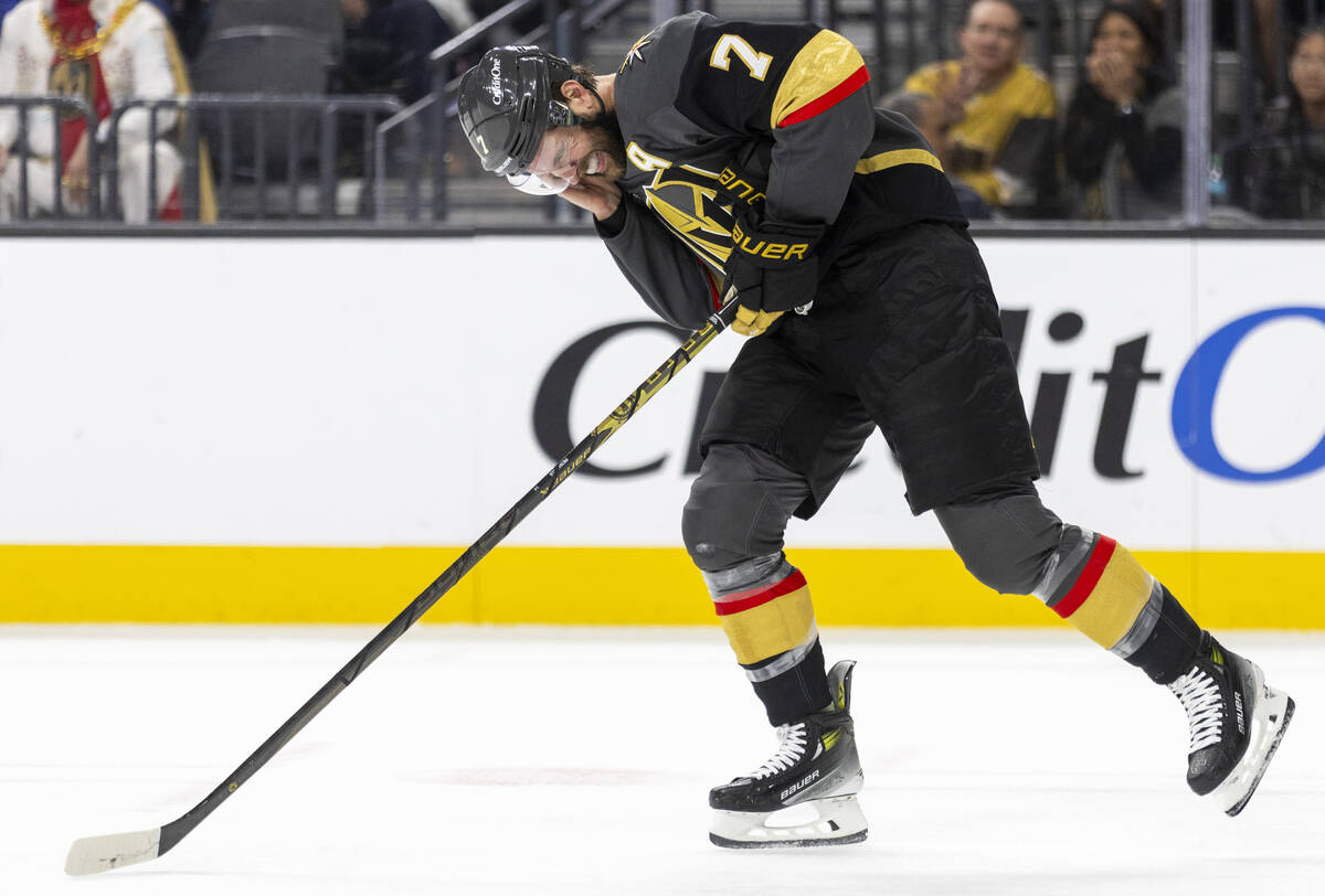 Golden Knights defenseman Alex Pietrangelo (7) holds his ear after taking a blow during the sec ...