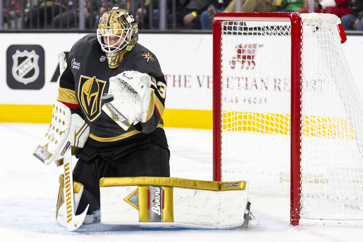 Golden Knights goaltender Adin Hill (33) makes a glove save during the second period of the NHL ...