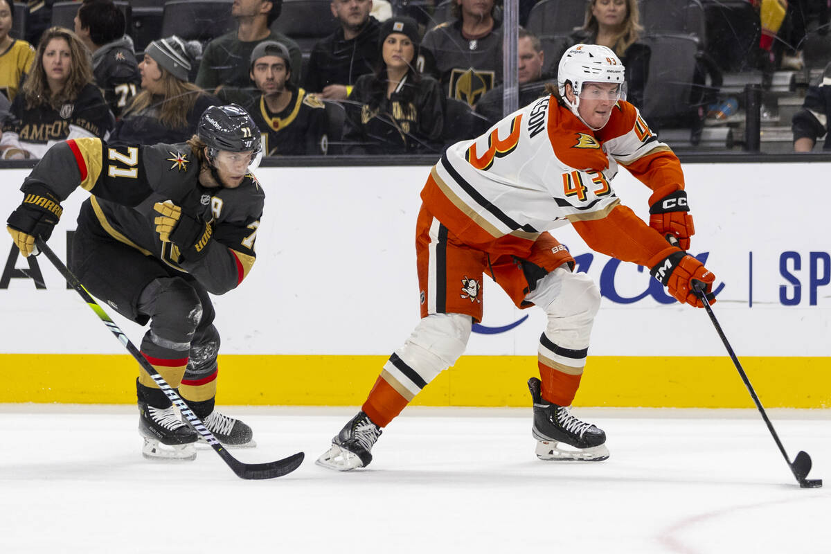 Golden Knights center William Karlsson (71) chases after Anaheim Ducks defenseman Drew Helleson ...