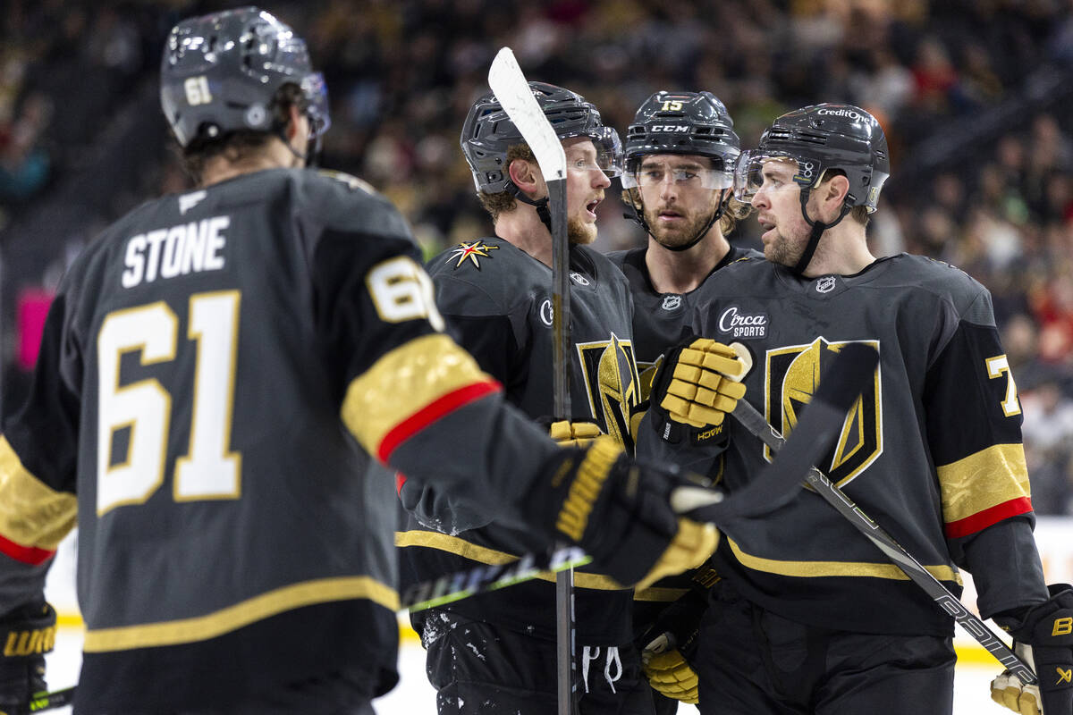 Golden Knights players talk before a face-off during the third period of the NHL hockey game ag ...