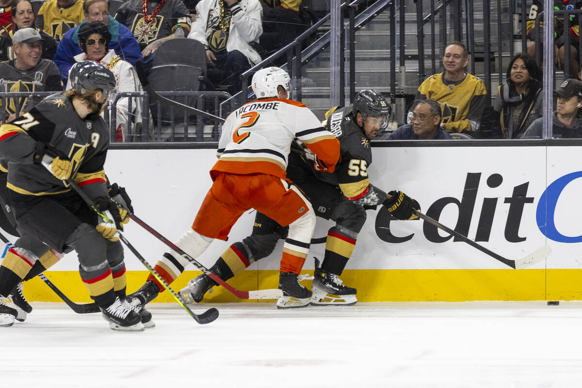 Golden Knights right wing Keegan Kolesar (55) and Anaheim Ducks defenseman Jackson LaCombe (2) ...