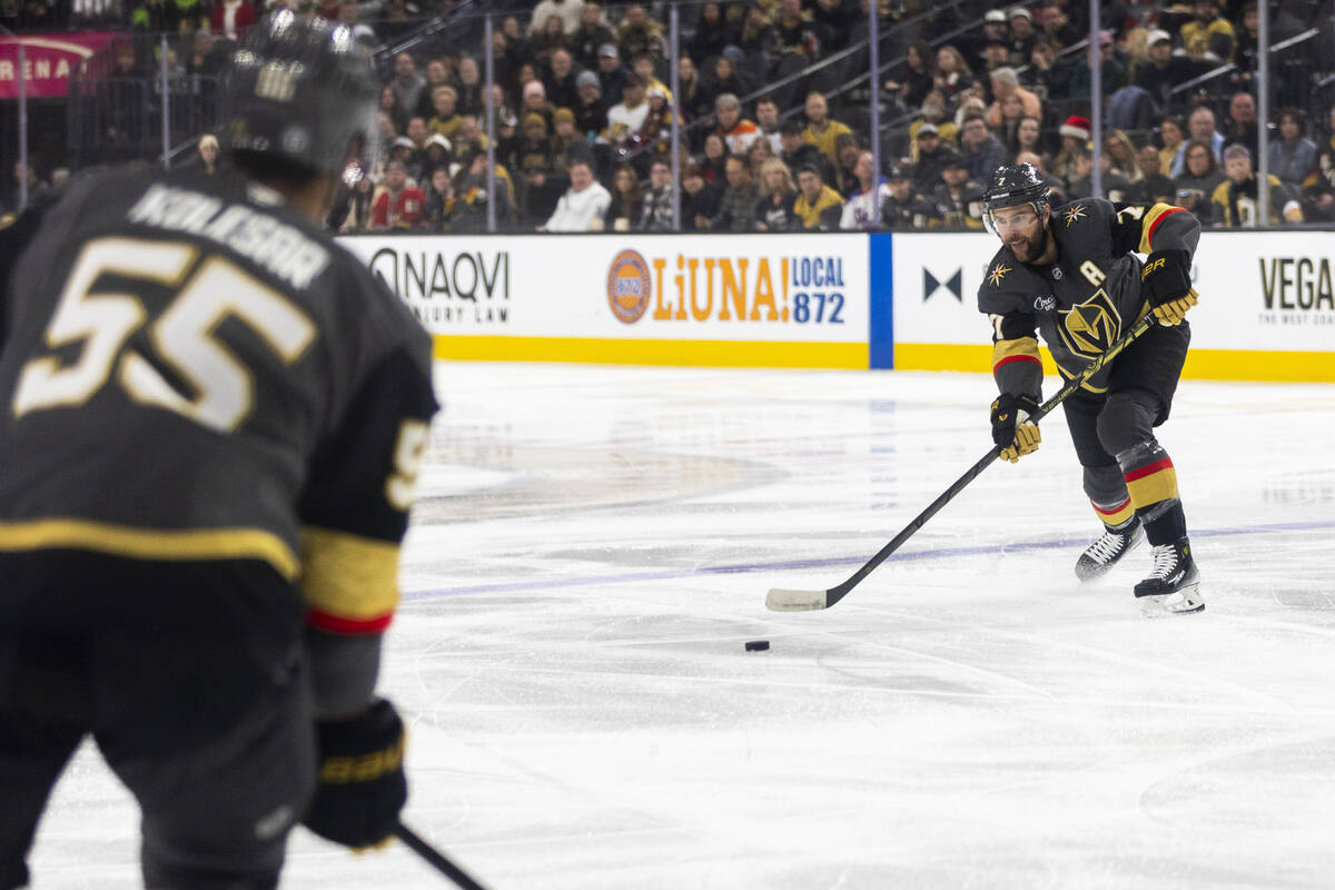 Golden Knights defenseman Alex Pietrangelo (7) passes the puck to right wing Keegan Kolesar (55 ...