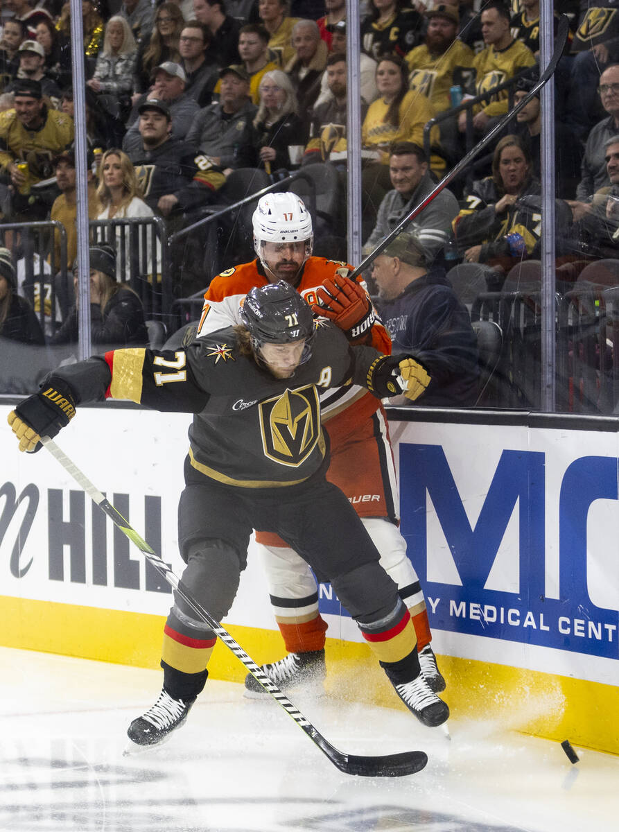 Golden Knights center William Karlsson (71) and Anaheim Ducks left wing Alex Killorn (17) compe ...