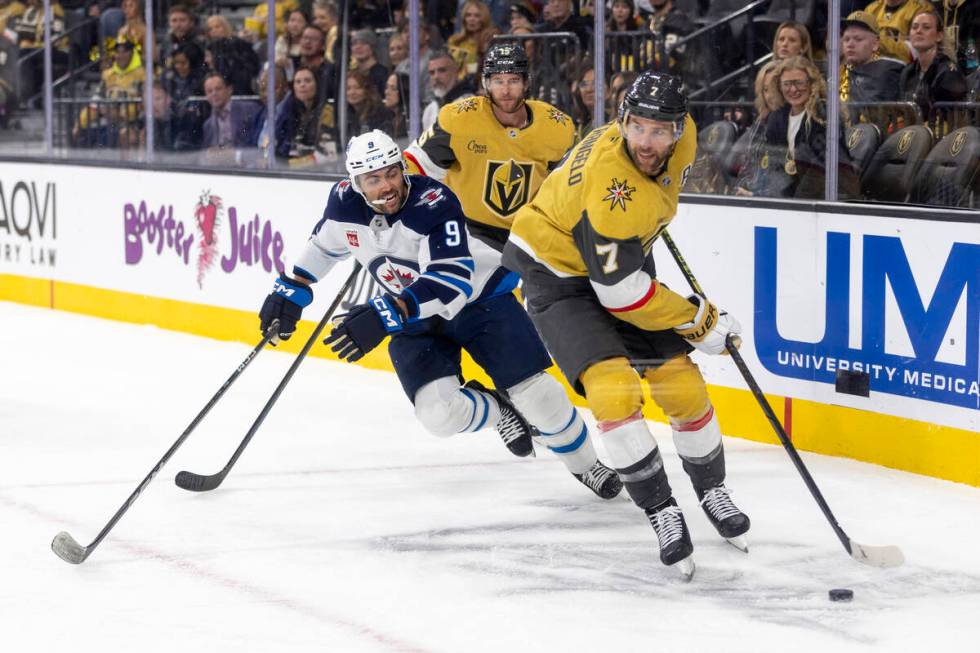 Golden Knights defenseman Alex Pietrangelo (7) takes the puck around the net during the second ...