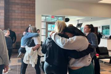 Family members of Renise "NeNe" Wolfe embrace after a court hearing on Dec. 24 for Markeem Bens ...