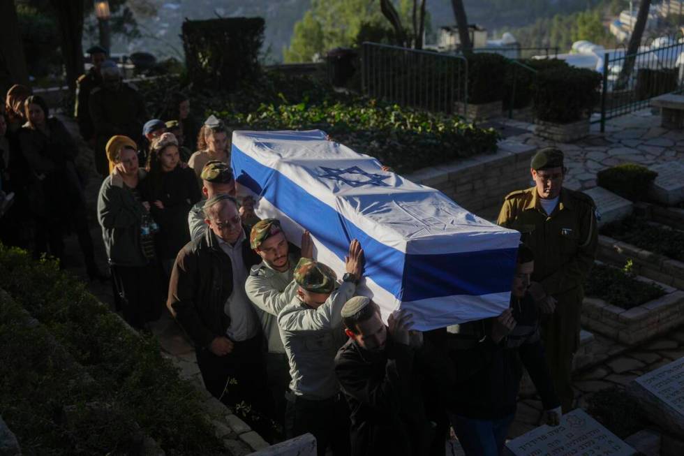 Israeli soldiers and relatives carry the flag-draped casket of 1st Sgt. Hillel Diener, who was ...