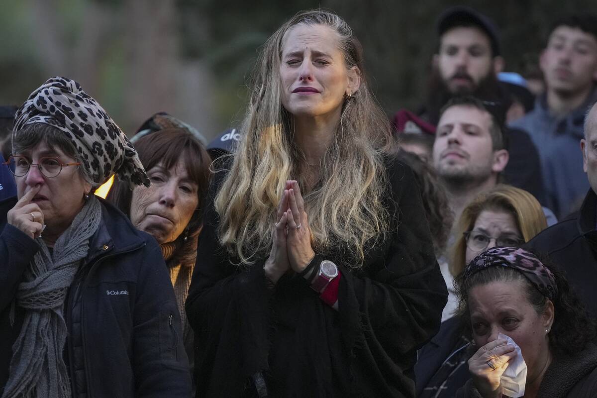 Relatives and friends of 1st Sgt. Hillel Diener, who was killed in combat in the Gaza Strip, mo ...