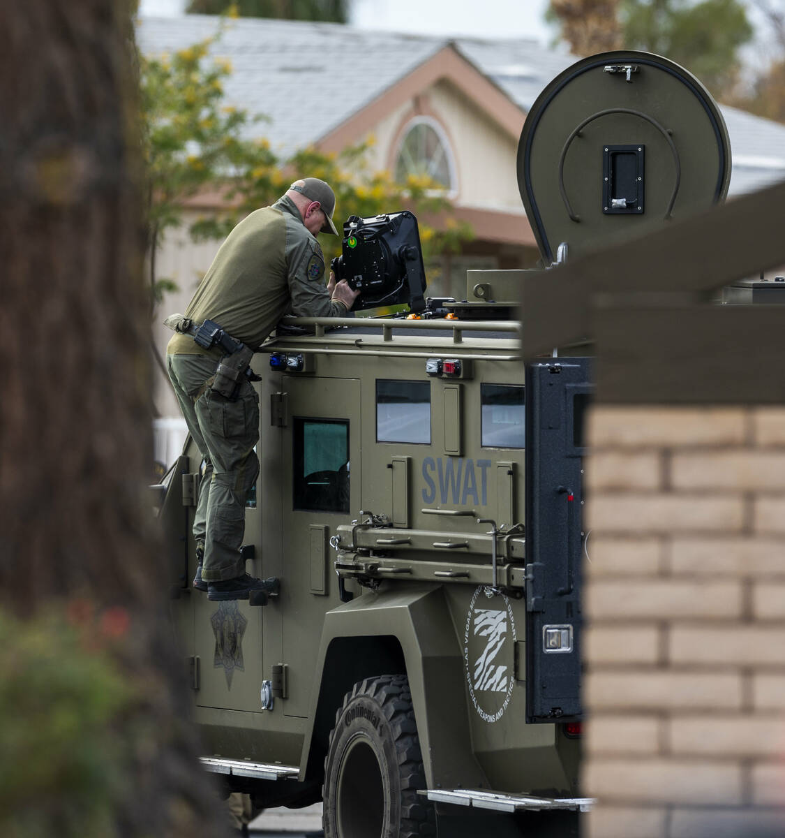 SWAT officers wrap up operations after Metropolitan Police Department takes a barricaded suspec ...