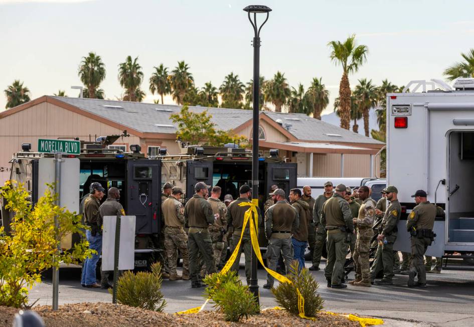 Personnel wrap up operations after the Metropolitan Police Department take a barricaded suspect ...