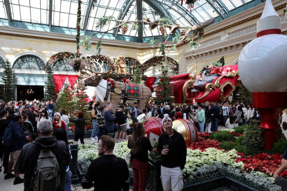 Guests take in ‘Twas holiday flower display at Bellagio Conservatory & Botanical Gar ...